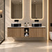 Wall-hung double vanity with fluted oak fronts, two round black sinks and central storage cabinet.