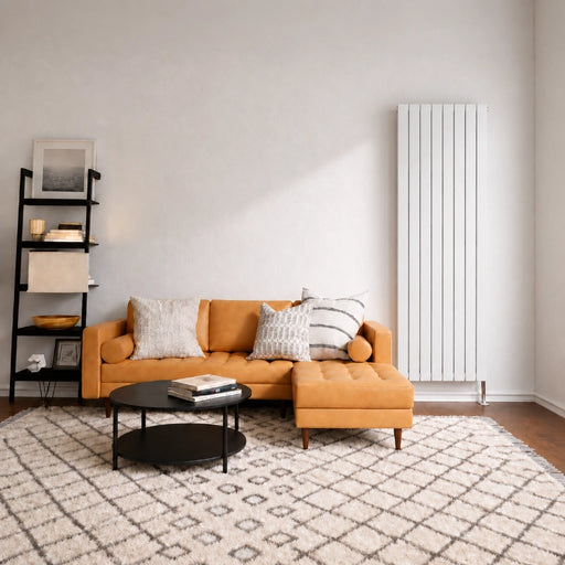 White vertical double-panel flat radiator mounted on wall above floor.