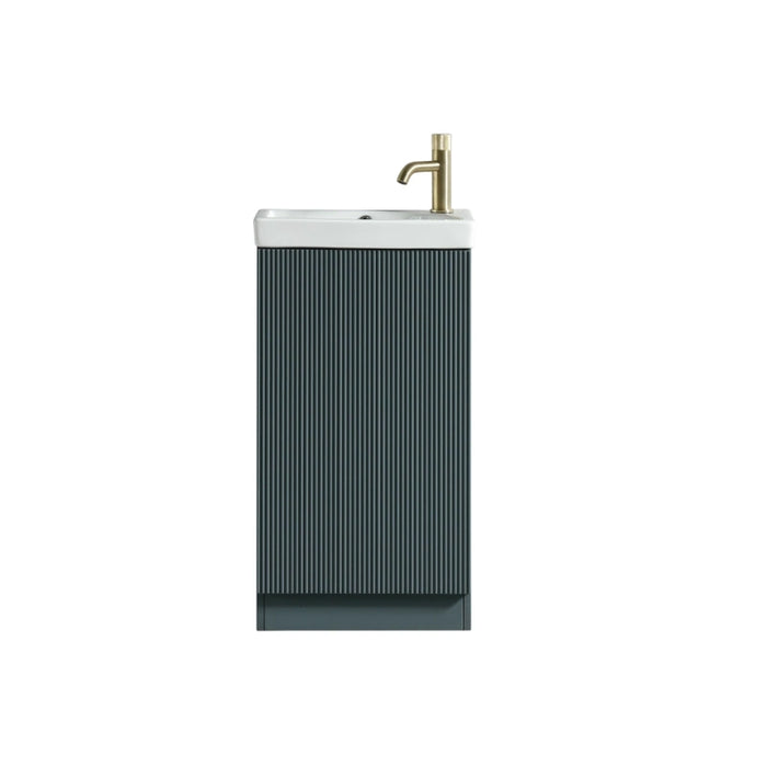 Smoked sage bathroom vanity cabinet with fluted front, white ceramic basin and brass tap