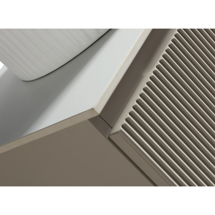 Vanity countertop corner detail with ribbed cabinet front and sink