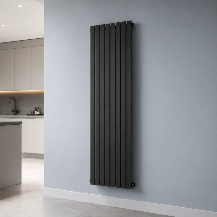 Black vertical flat panel radiator mounted on wall, slim vertical fins