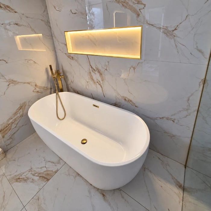White oval freestanding bath tub, 1700 x 750mm, with gold-style filler and drain