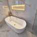 White oval freestanding bath tub, 1700 x 750mm, with gold-style filler and drain