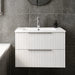 Matt white fluted wall-hung vanity unit with integrated basin and two drawers