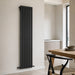 Black vertical double-panel radiator, flat bar design, wall-mounted heating panel