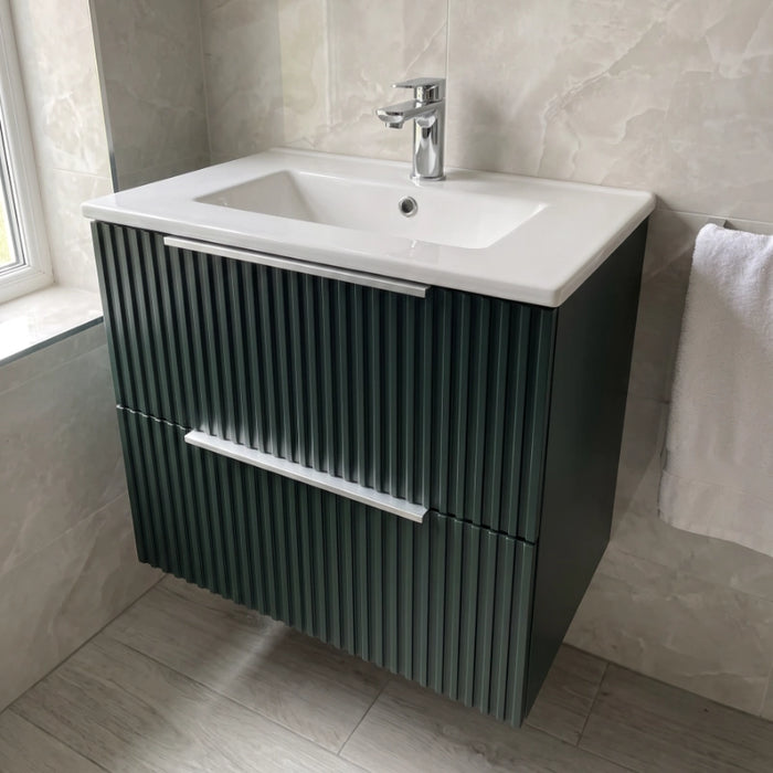 Wall-hung fluted vanity with white basin, matt forest green, silver faucet, metal drawer handle