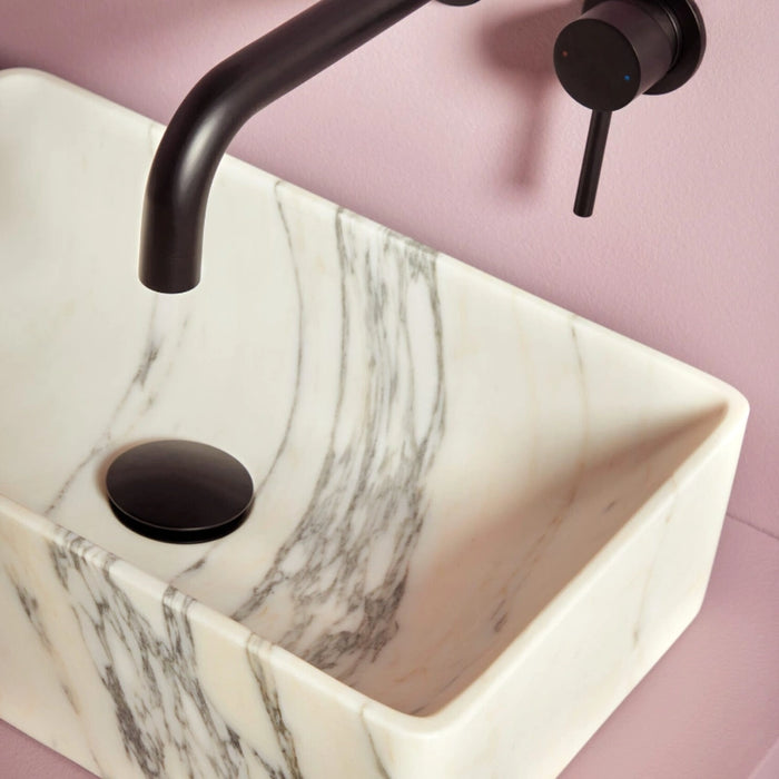 Wall-mounted round basin tap with curved spout, matt black finish