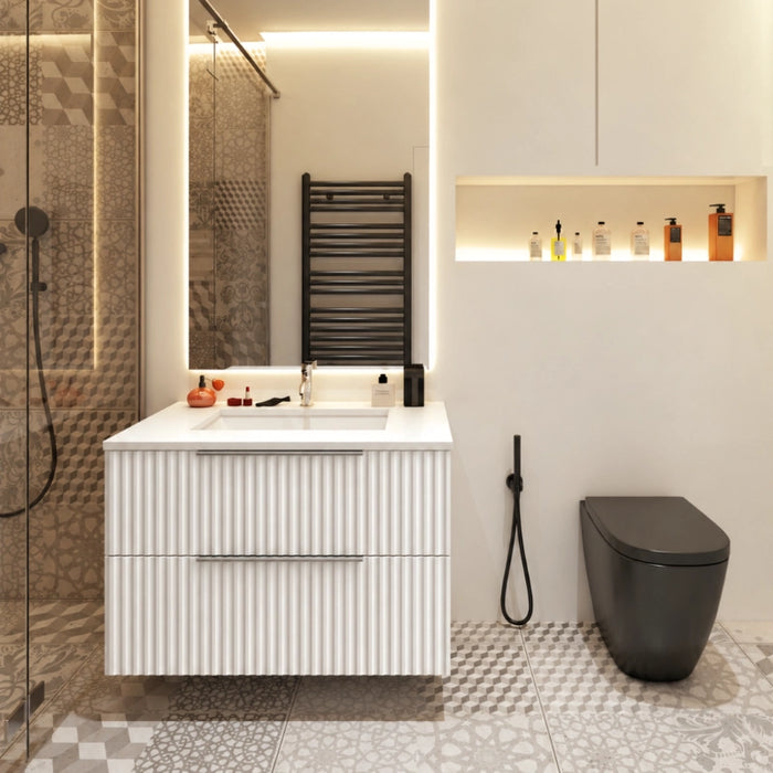 Matt white fluted wall-hung vanity with basin, two drawers, and metal bar handles