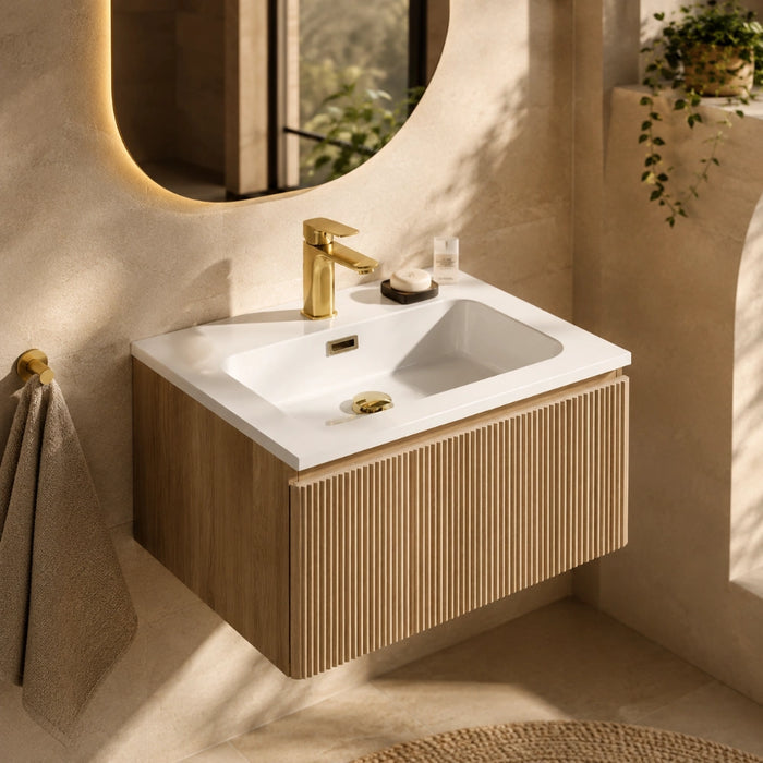 Wall-mounted vanity with white basin, country oak fluted cabinet and brass mixer tap