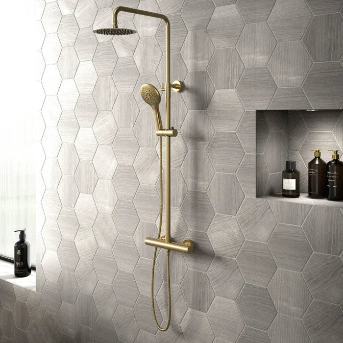 Brushed brass shower set with round rain head, T-bar, hand shower, and basin tap